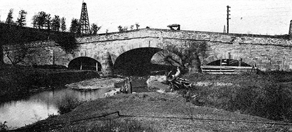John Kennedy Lacock Photograph from Robert Bruce's <i>The National Road</i>: Three span stone arch bridge carrying the National Pike over Chartiers Creek, two miles west of Washington, Pa.